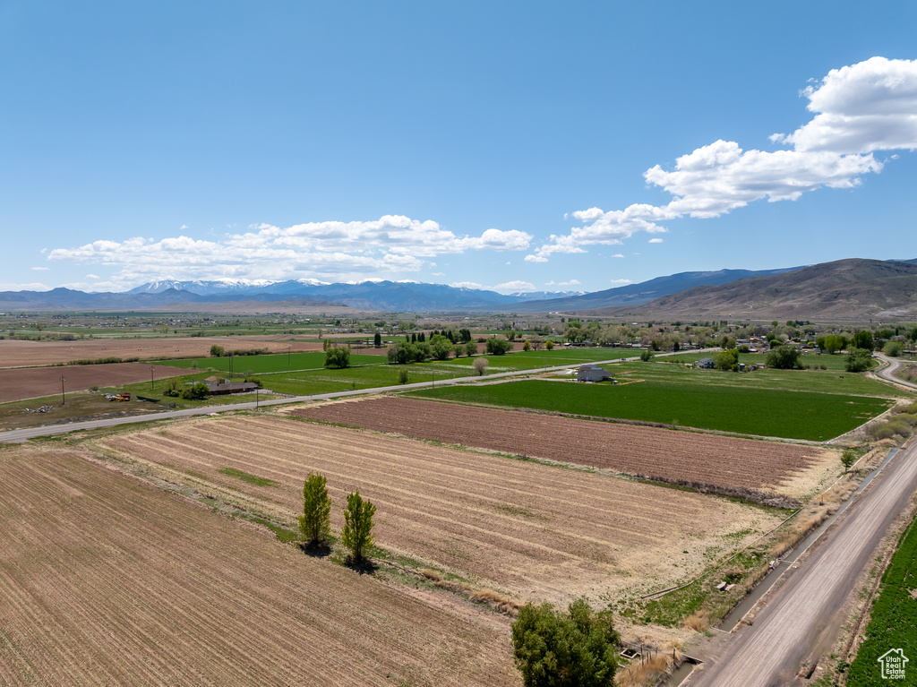 View of mountain background with rural landscape and large plots for crops
