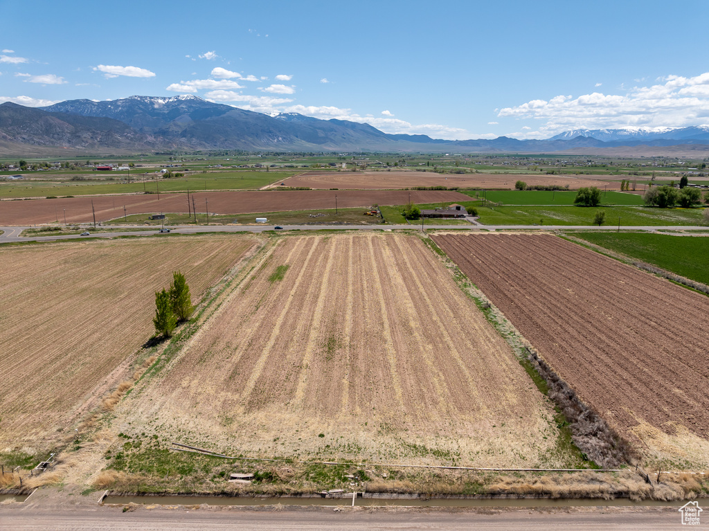 Overview of rural landscape with abundant farmland and a mountainous background