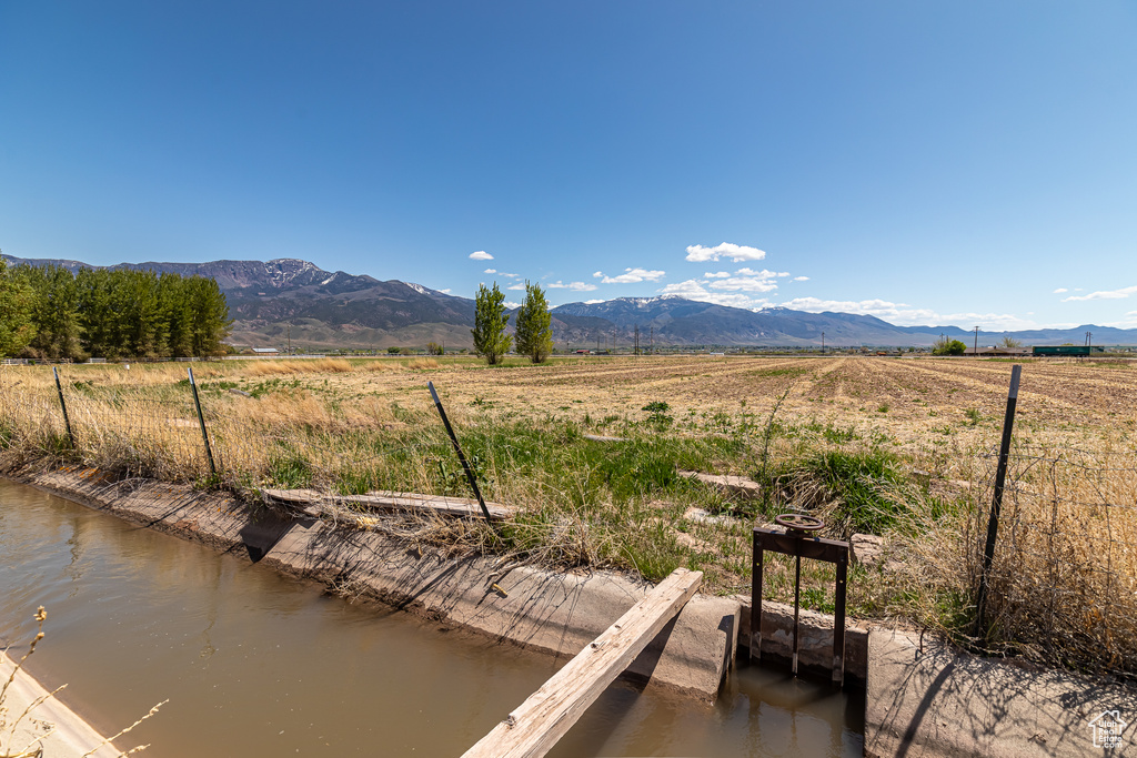 View of mountain backdrop featuring rural landscape