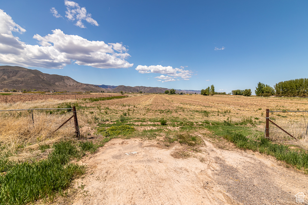 View of mountain background featuring rural landscape