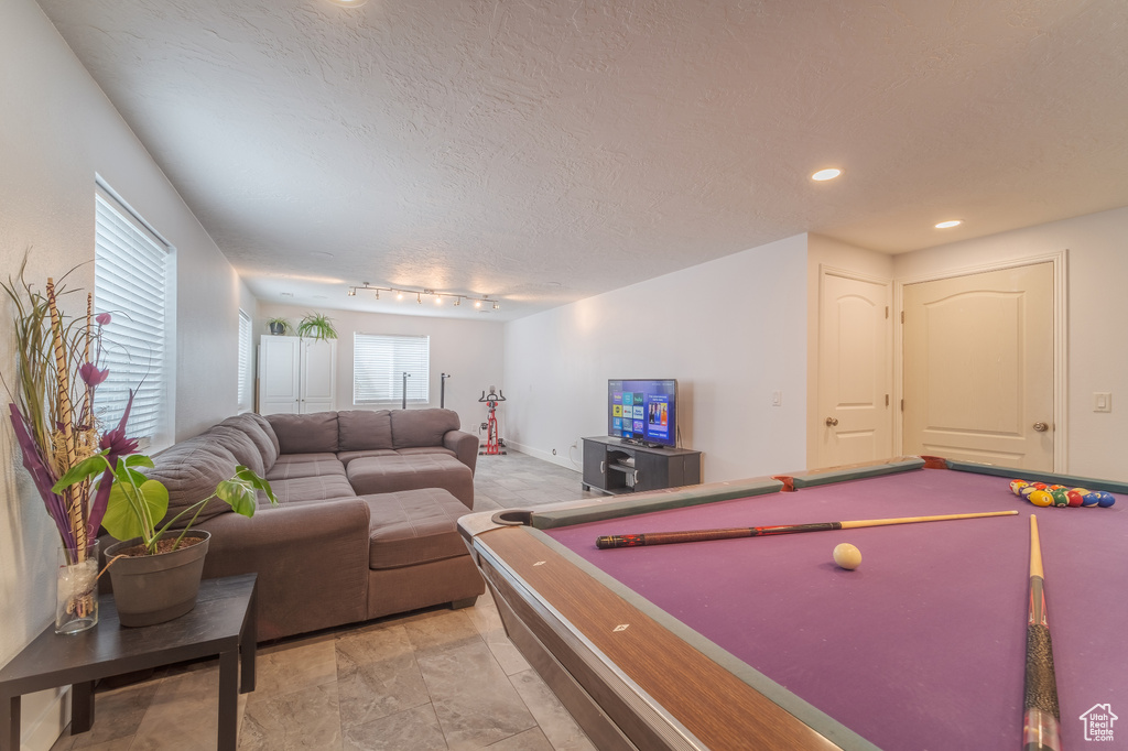 Game room featuring billiards table, track lighting, a textured ceiling, recessed lighting, and baseboards