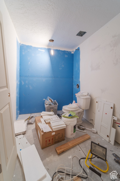 Bathroom with a textured ceiling