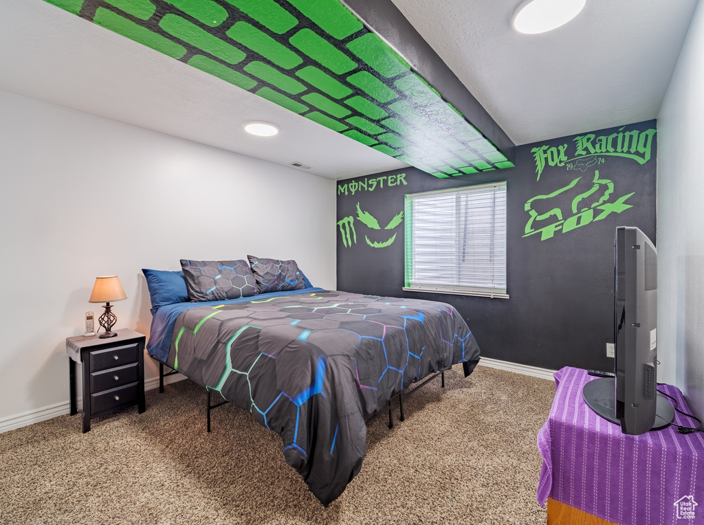 Bedroom with carpet and baseboards