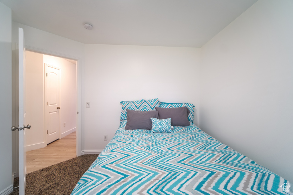 Carpeted bedroom with baseboards