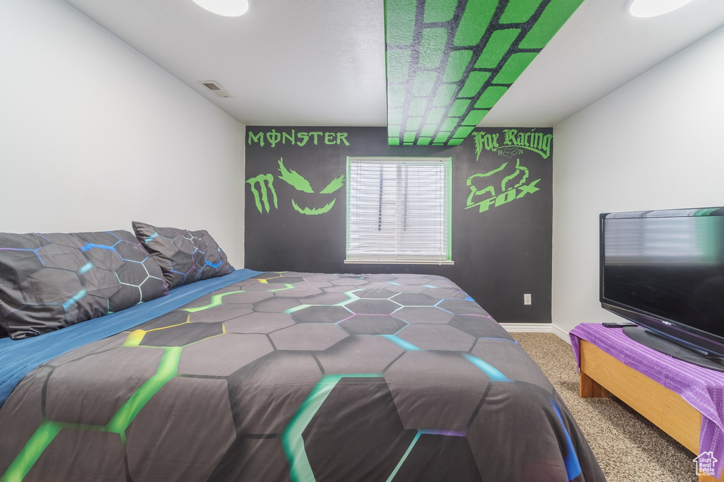 Carpeted bedroom with baseboards
