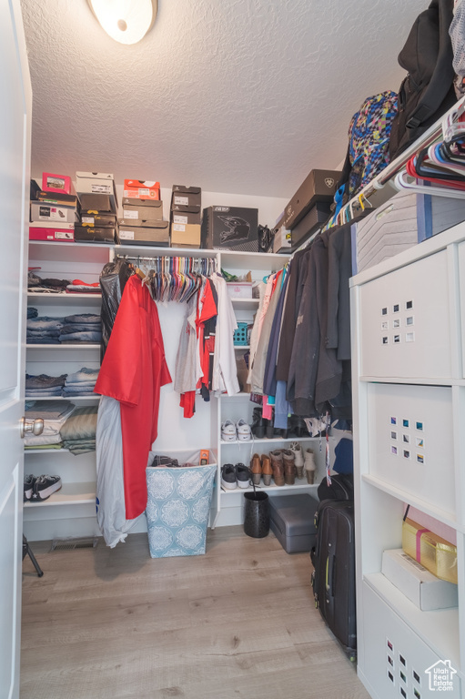 Spacious closet featuring wood finished floors