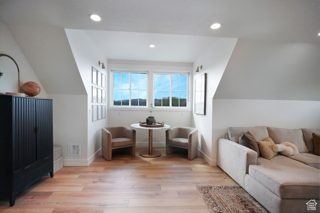 Sitting room featuring wood finished floors, baseboards, and recessed lighting