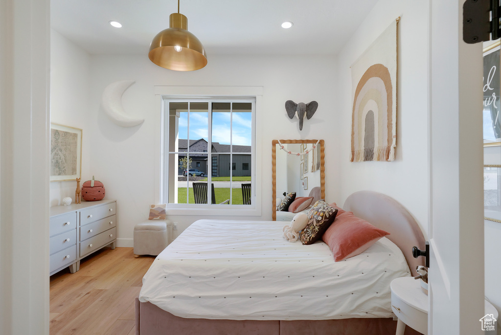 Bedroom with light wood-type flooring and recessed lighting
