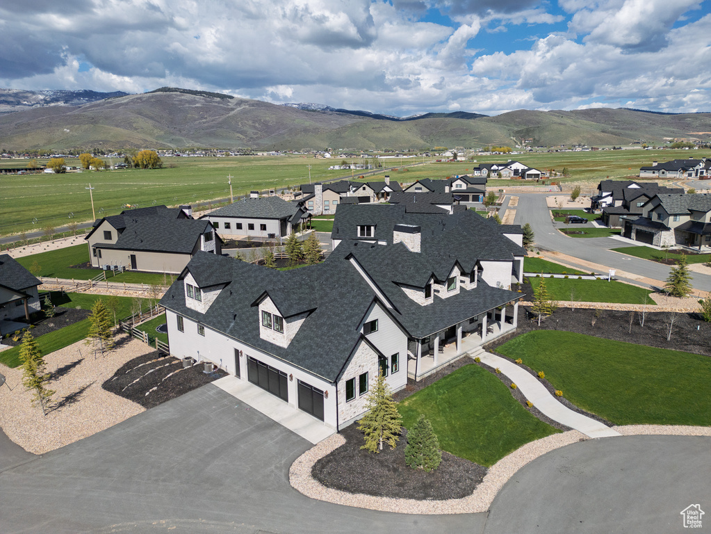 Aerial view of residential area featuring mountains