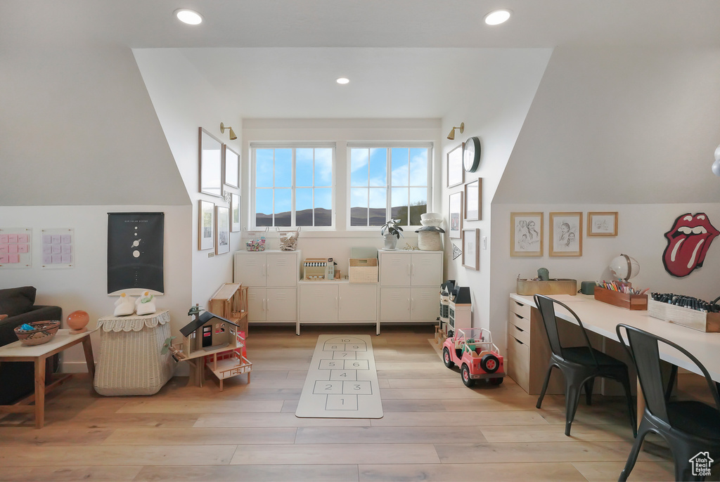 Game room featuring light wood-type flooring and recessed lighting