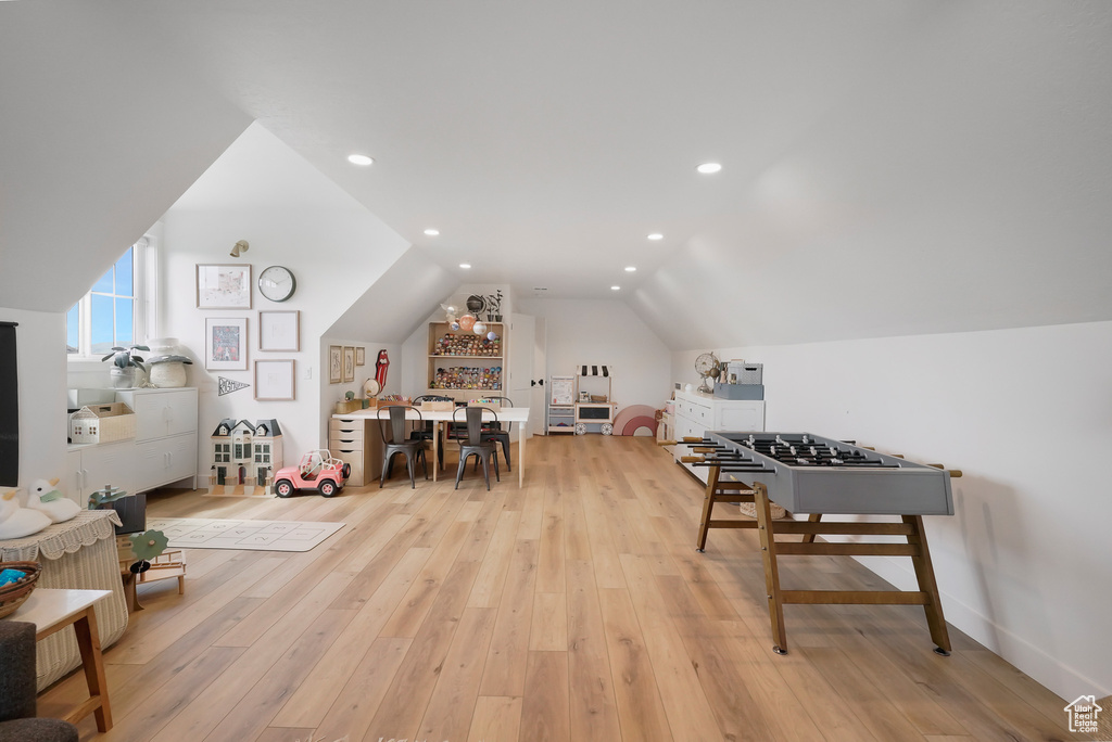 Rec room featuring lofted ceiling, light wood finished floors, and recessed lighting