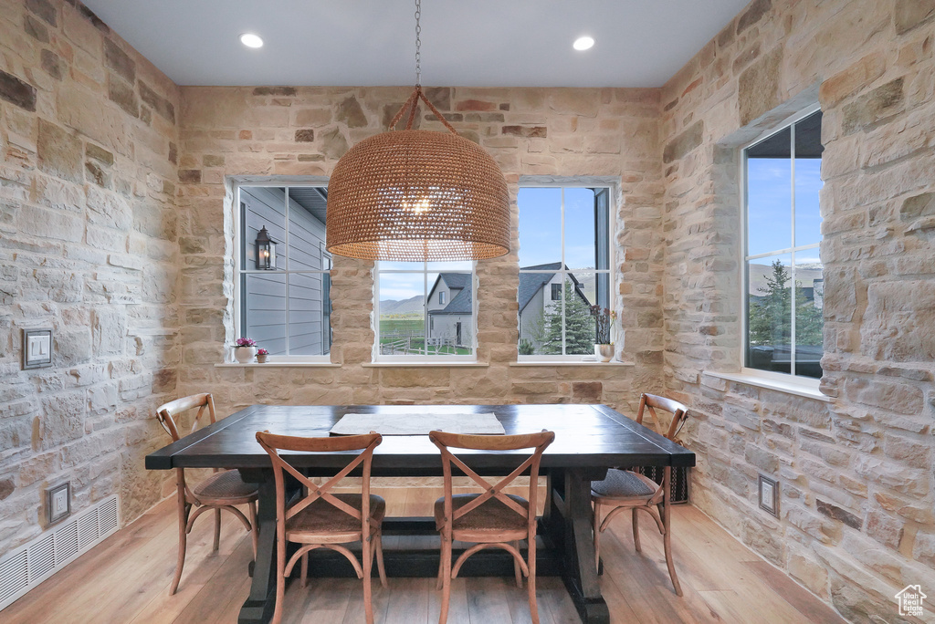 Dining space featuring hardwood / wood-style flooring, healthy amount of natural light, and recessed lighting