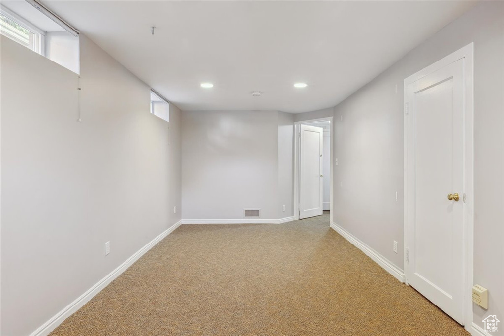 Below grade area featuring recessed lighting, carpet flooring, and baseboards