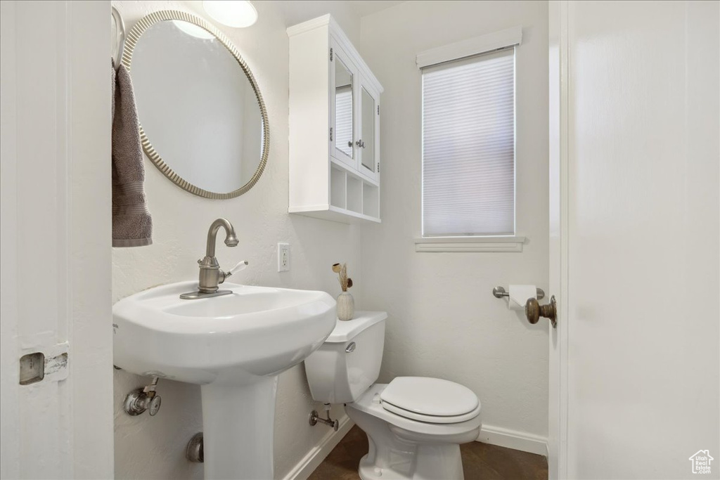 Bathroom featuring toilet and baseboards