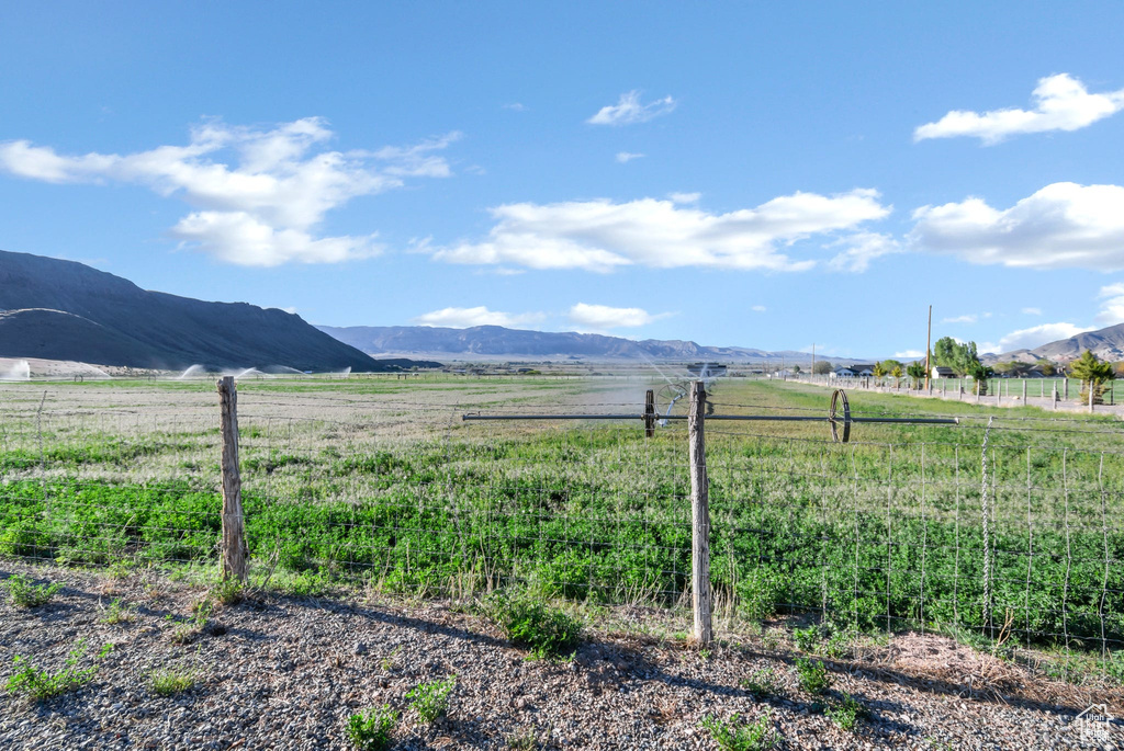 View of mountain background featuring rural landscape