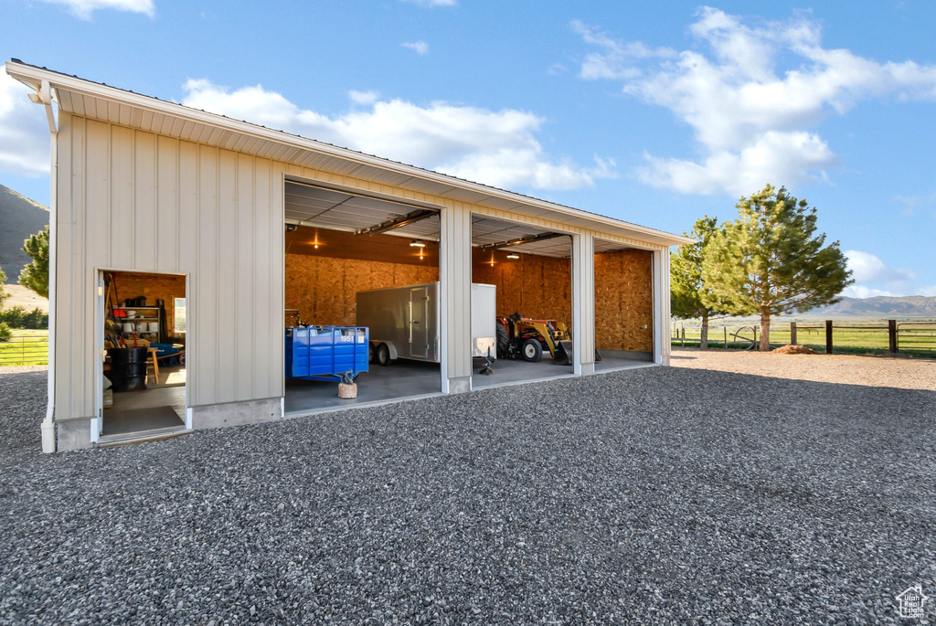 Garage featuring fence