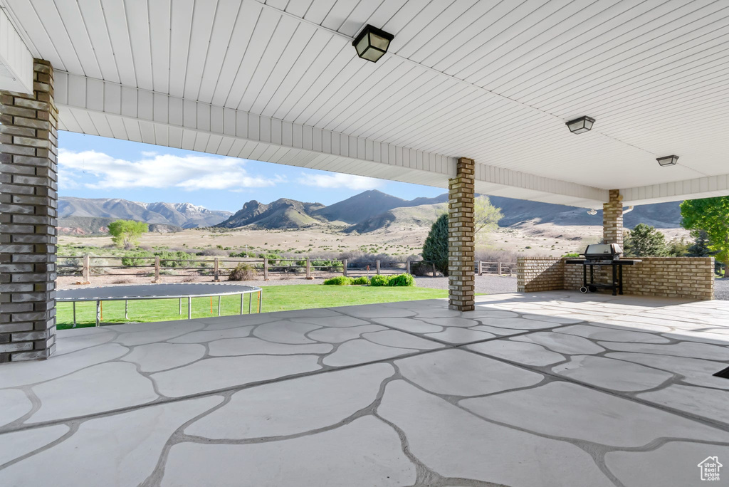 View of patio featuring a mountain view and grilling area