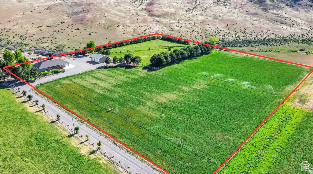 Aerial view of sparsely populated area featuring property boundaries highlighted