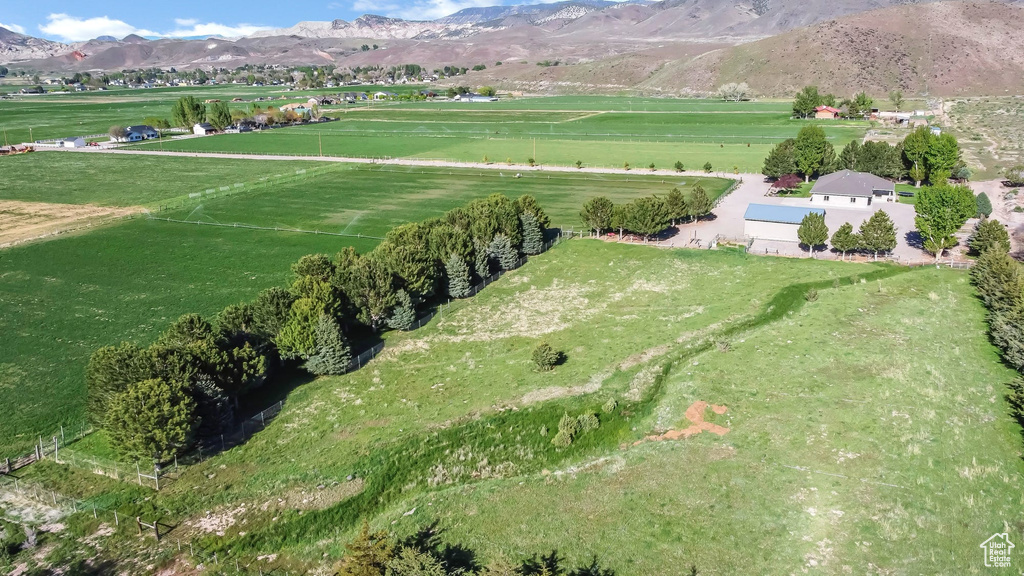 View of property location featuring a mountainous background and rural landscape