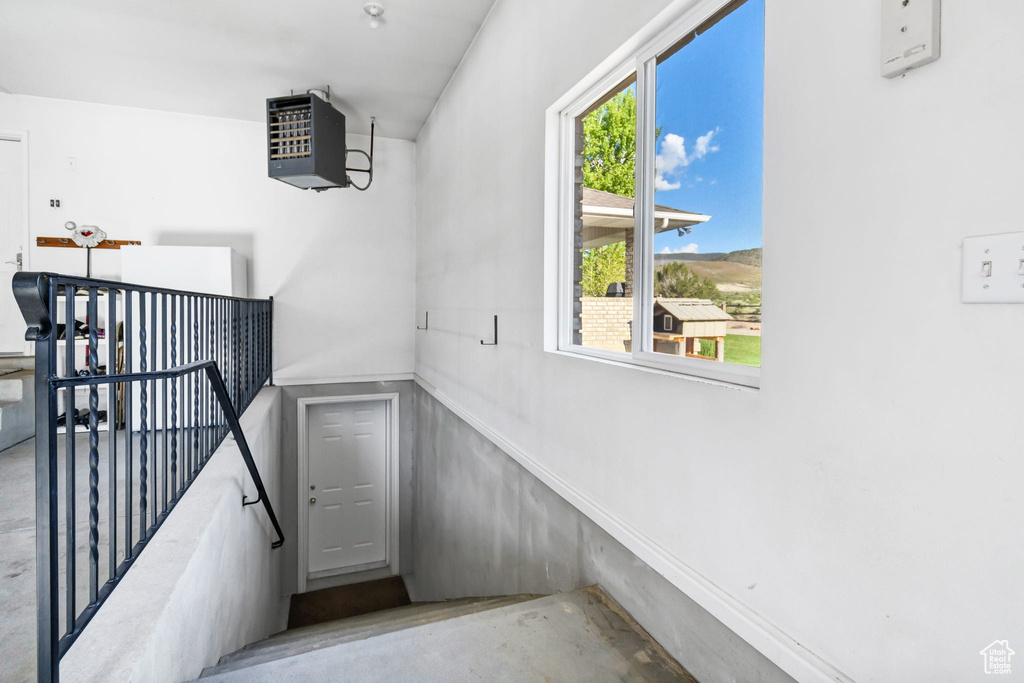 Staircase with a heating unit and concrete floors