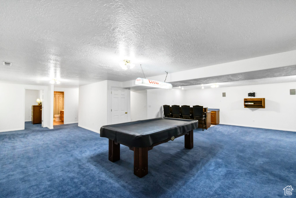 Recreation room with billiards table, carpet, a textured ceiling, and baseboards