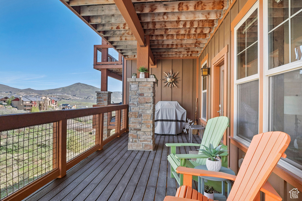 Wooden terrace with a mountain view and grilling area