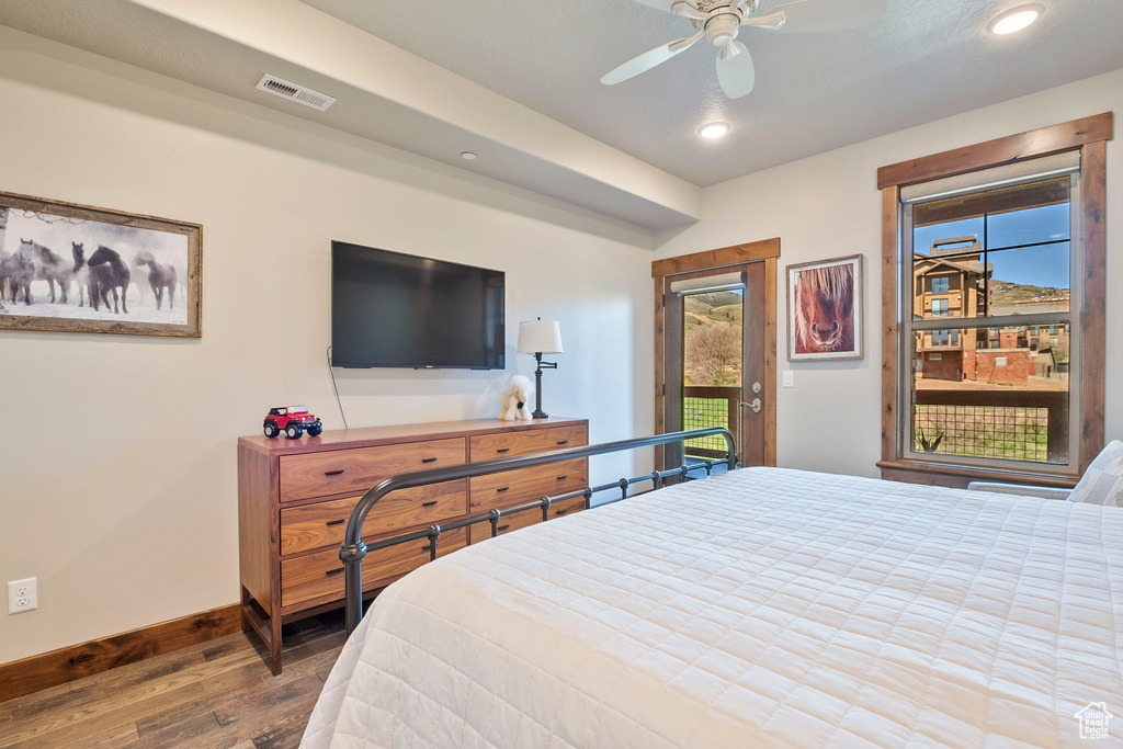 Bedroom with hardwood / wood-style flooring, access to outside, baseboards, recessed lighting, and ceiling fan