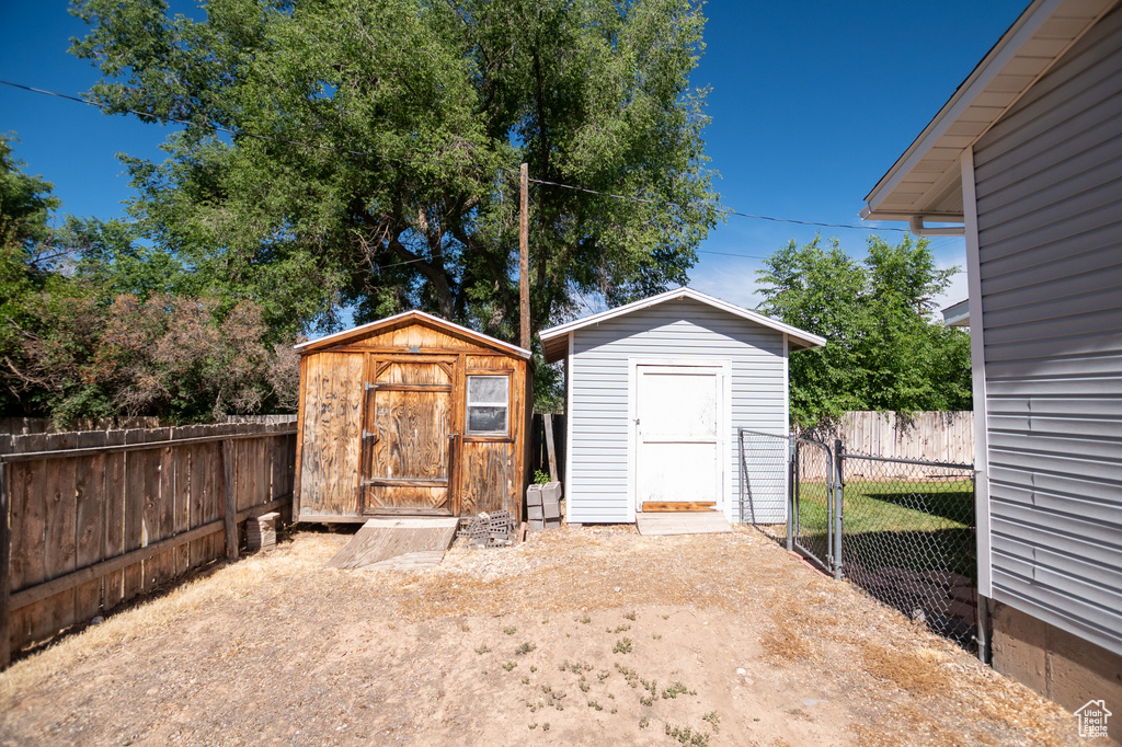 View of shed with a fenced backyard