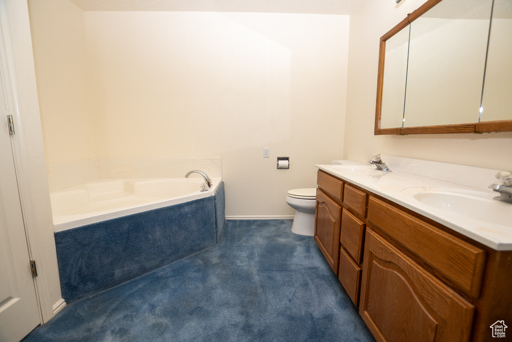 Full bath featuring double vanity and a bath