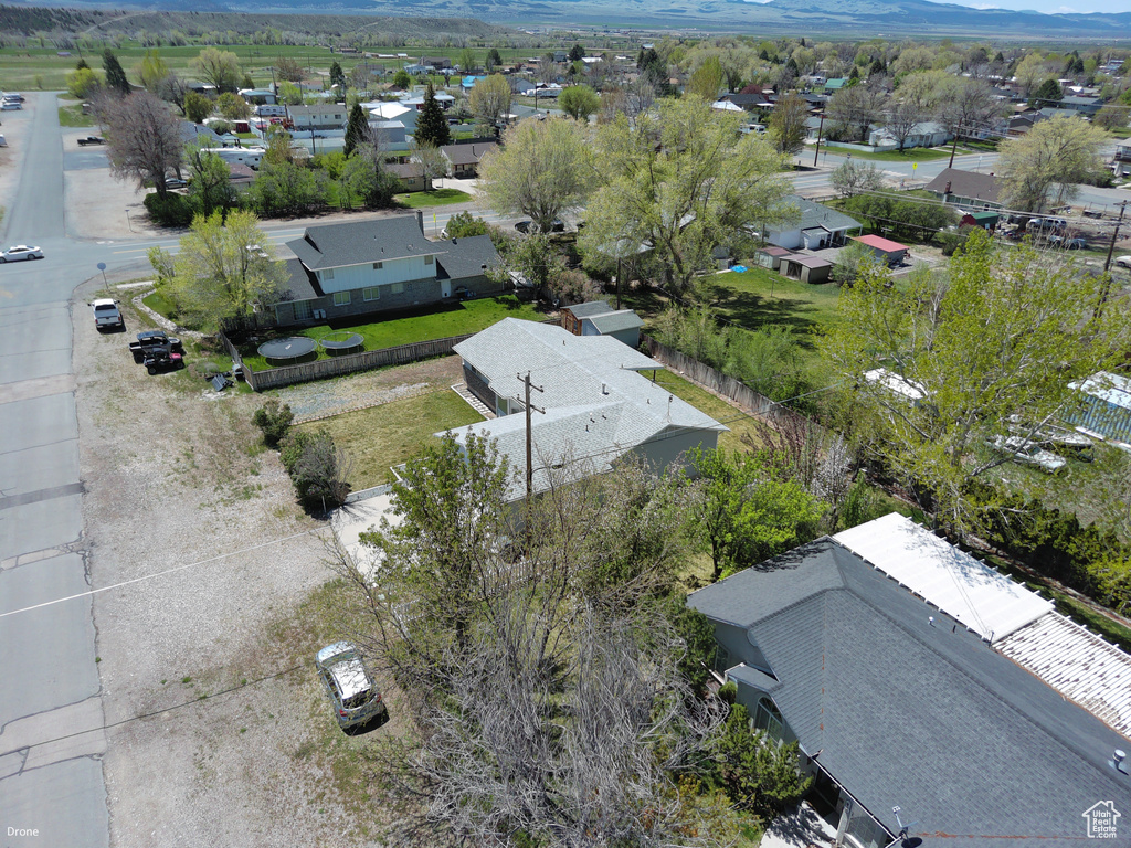 Aerial perspective of suburban area with a mountainous background