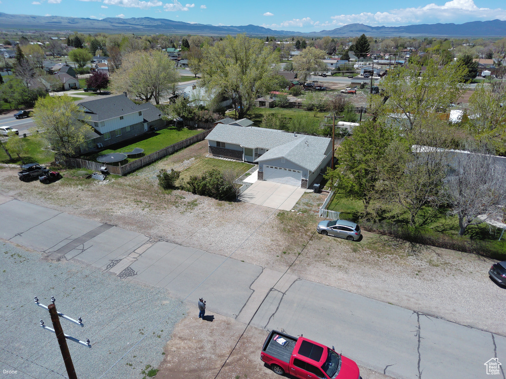 Aerial perspective of suburban area featuring a mountain backdrop