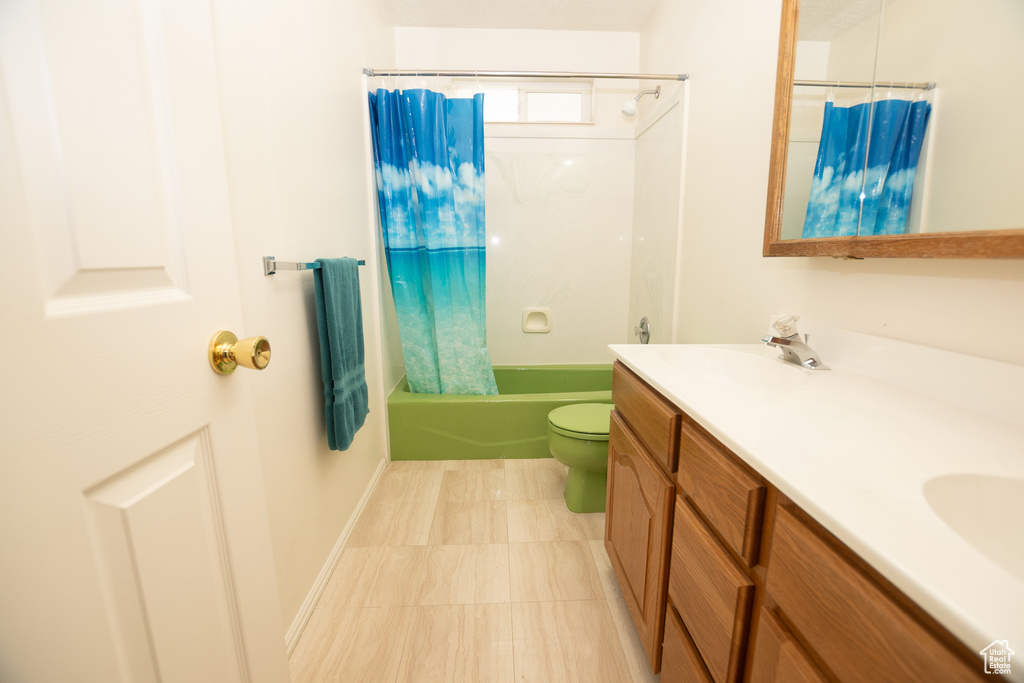 Full bathroom featuring double vanity and shower / bath combo with shower curtain