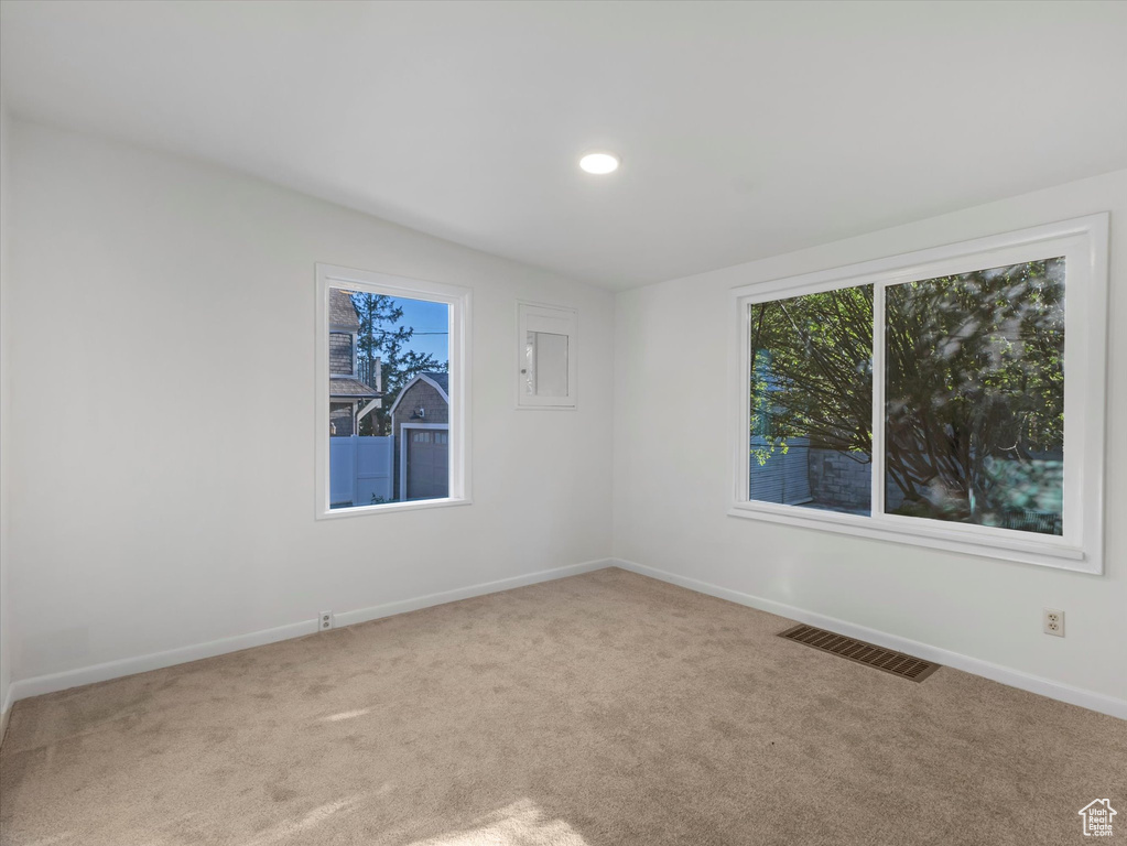 Unfurnished room featuring carpet flooring, baseboards, and recessed lighting