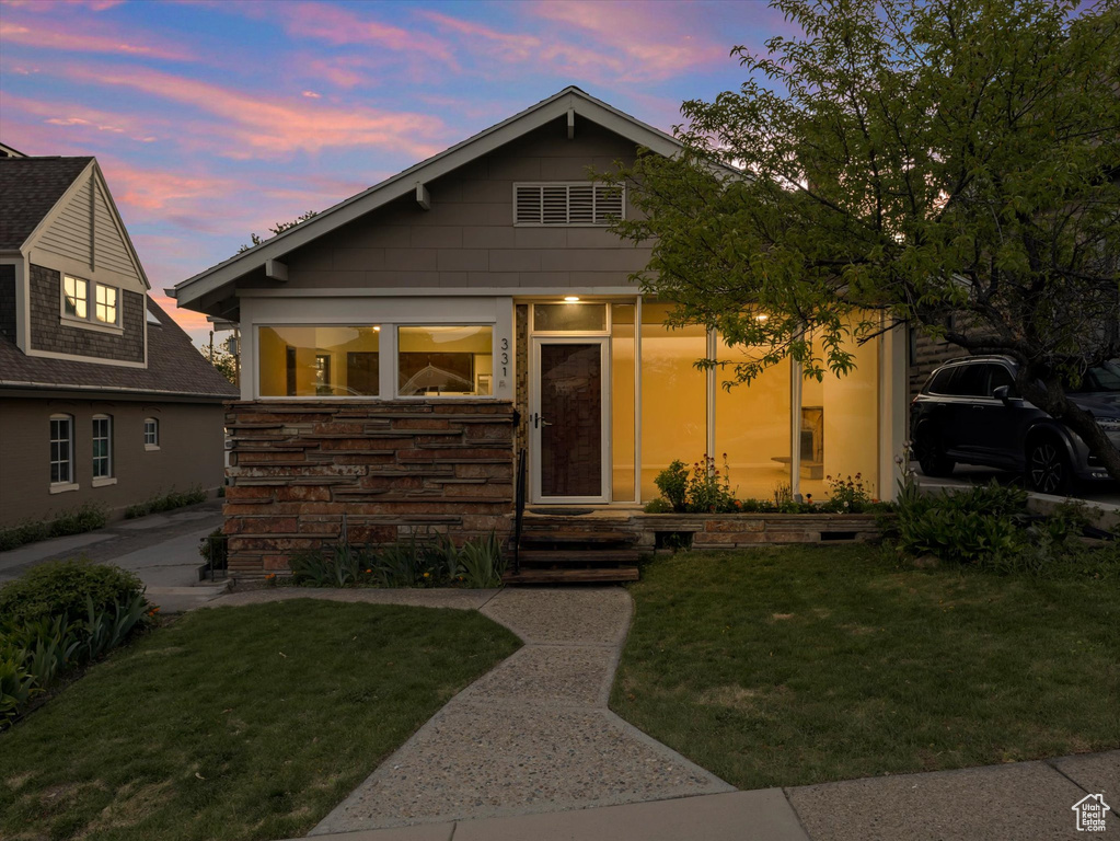 View of front of property with a front lawn