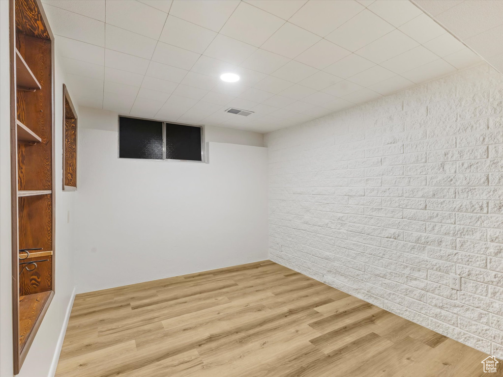 Finished below grade area featuring wood finished floors