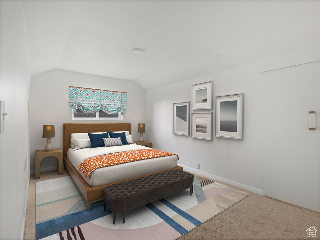 Carpeted bedroom with vaulted ceiling and baseboards