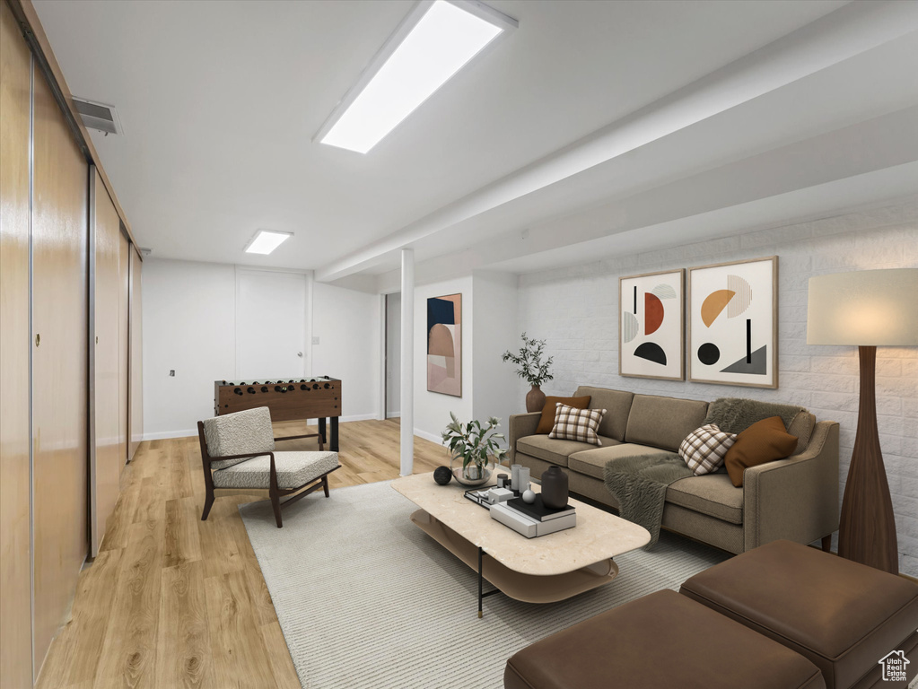 Living area with light wood-type flooring and baseboards