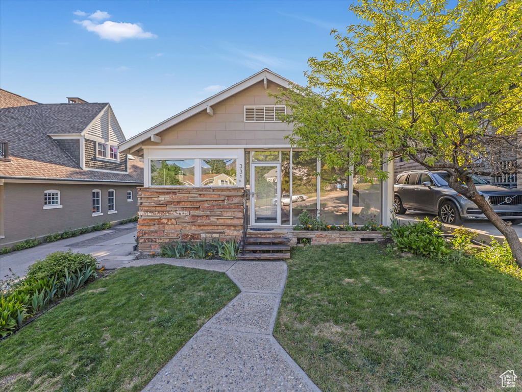 View of front of house with a front lawn
