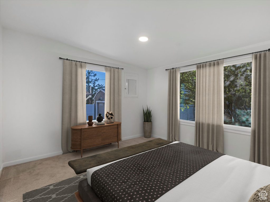 Bedroom with carpet, lofted ceiling, and recessed lighting