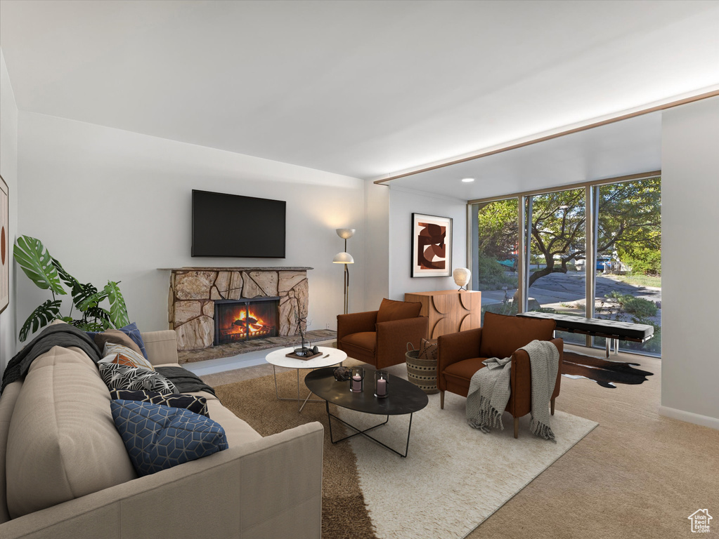 Living area with carpet floors and a fireplace