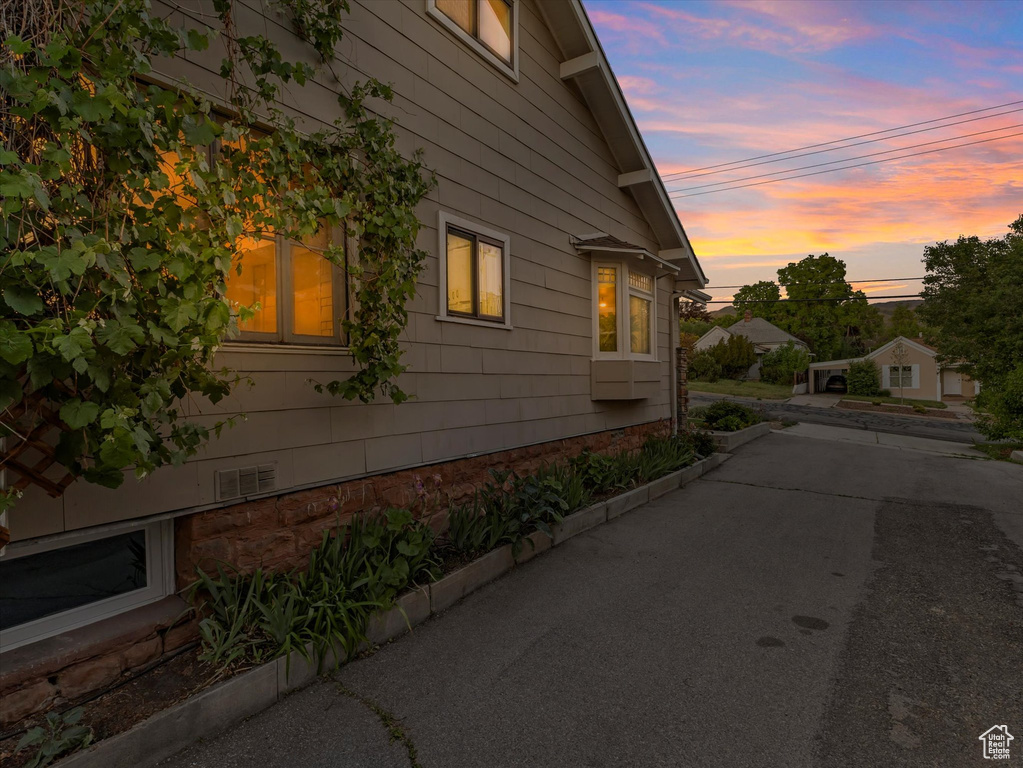 View of property exterior at dusk