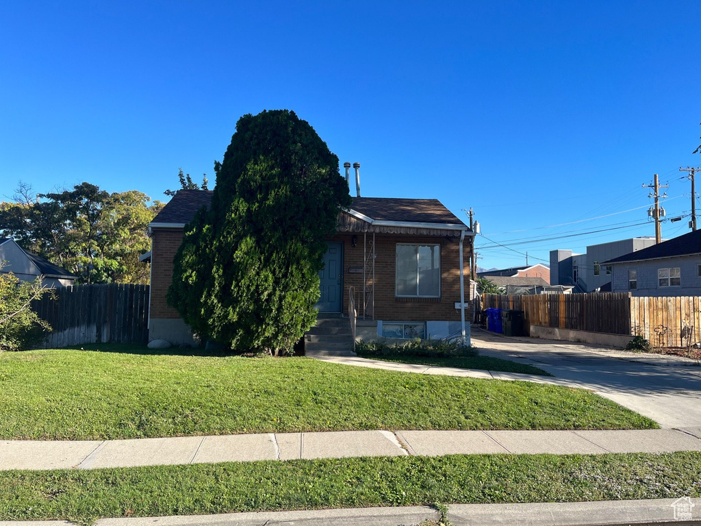 View of front of house with brick siding