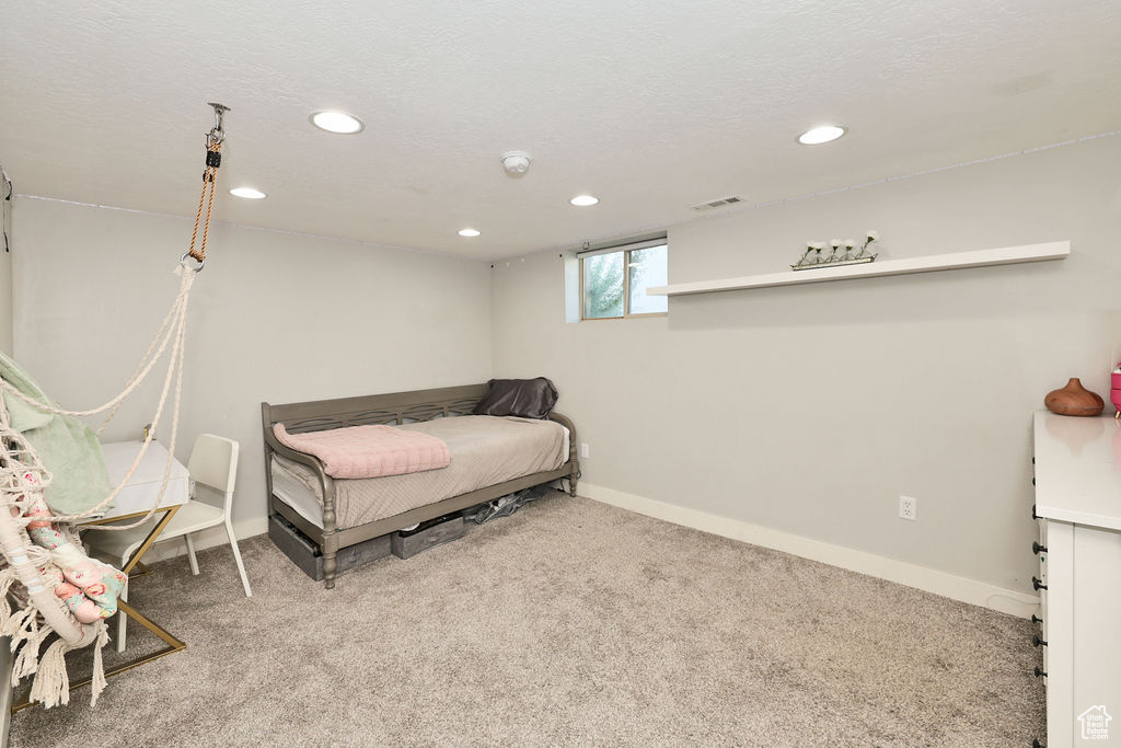 Bedroom featuring recessed lighting, carpet flooring, and baseboards