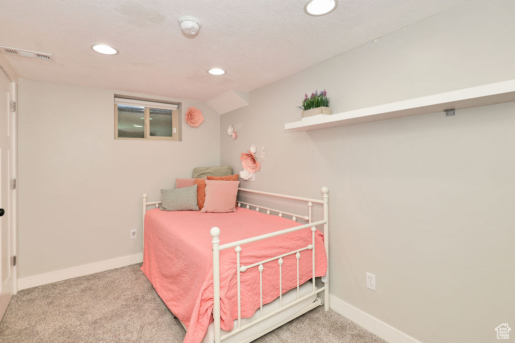 Bedroom with carpet flooring, recessed lighting, and baseboards