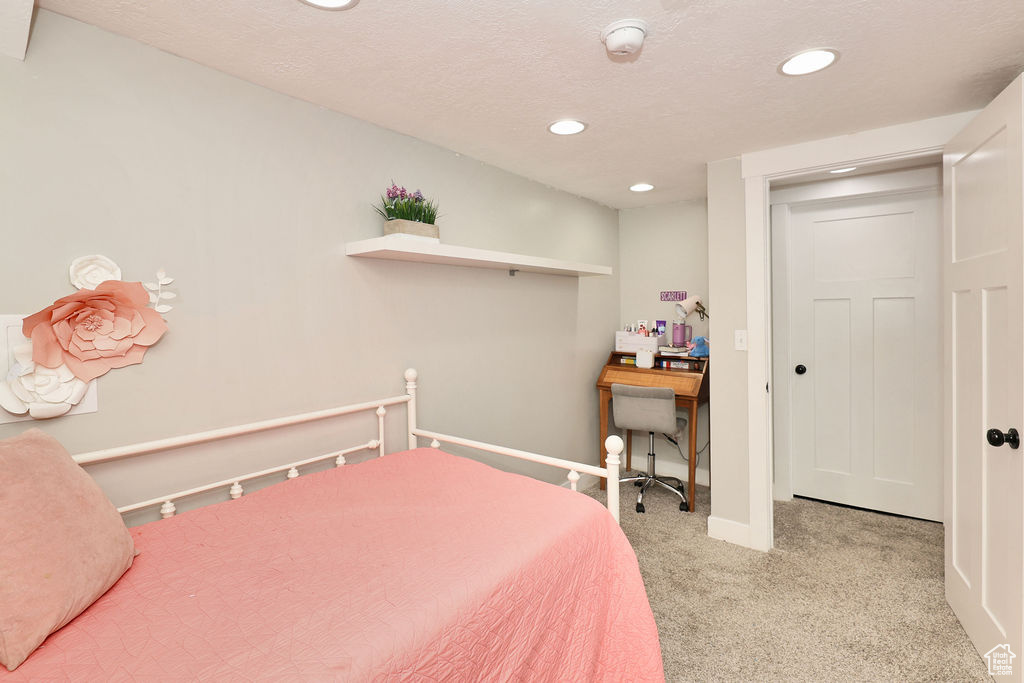 Bedroom featuring carpet, recessed lighting, and baseboards