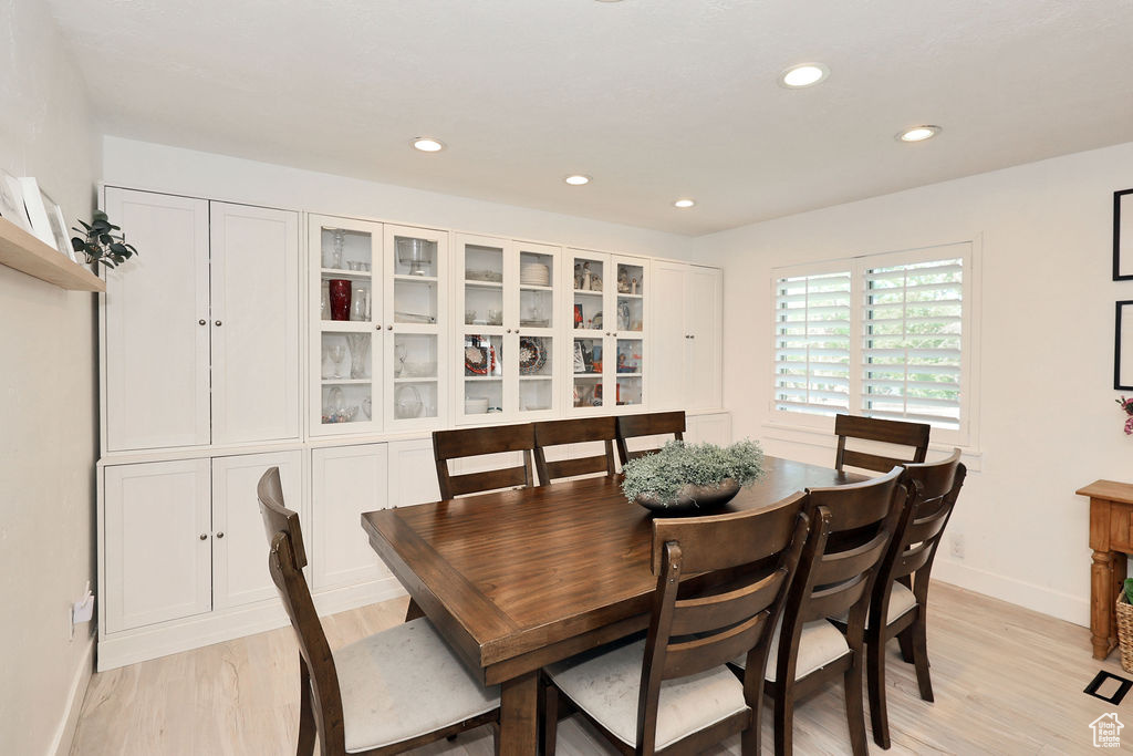 Dining space featuring baseboards, recessed lighting, and light wood-type flooring