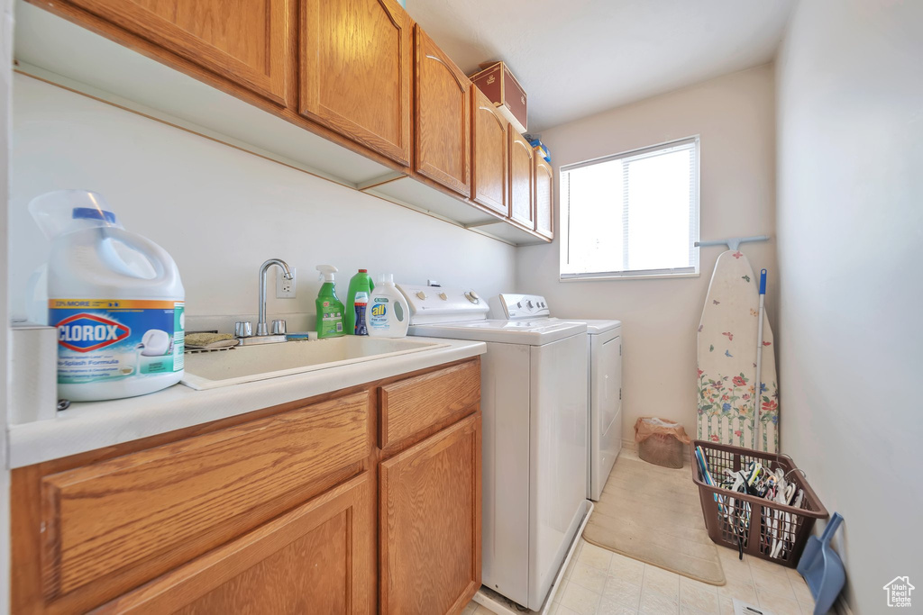 Laundry area with washer and dryer and cabinet space