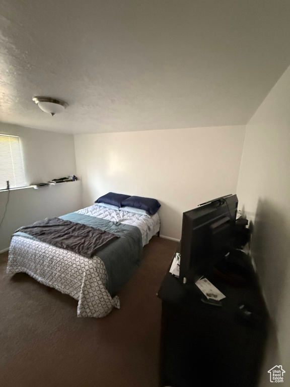 Bedroom with carpet and baseboards