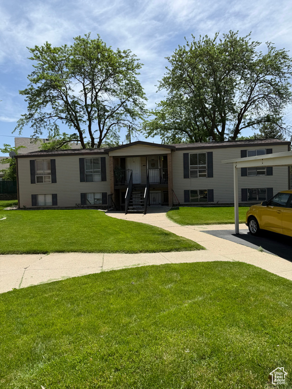 View of front of house with a front yard