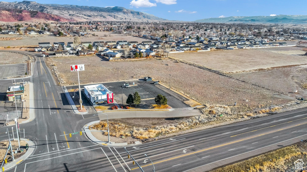 Aerial perspective of suburban area with a mountain backdrop